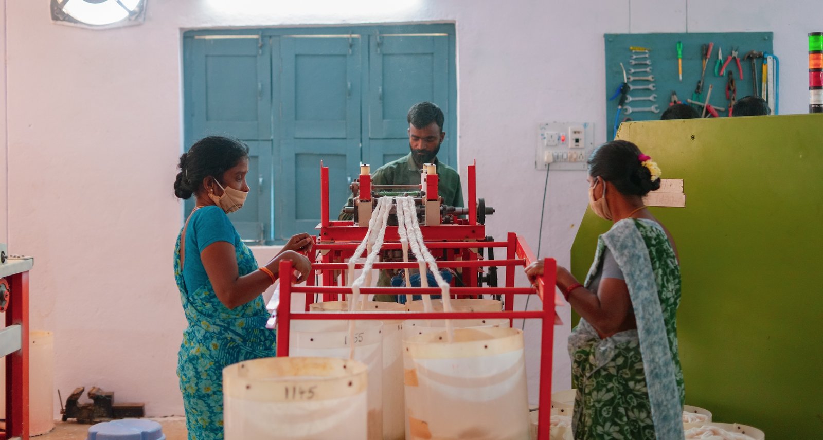 Burgula community members working on decentralised cotton yarn spinning machinery